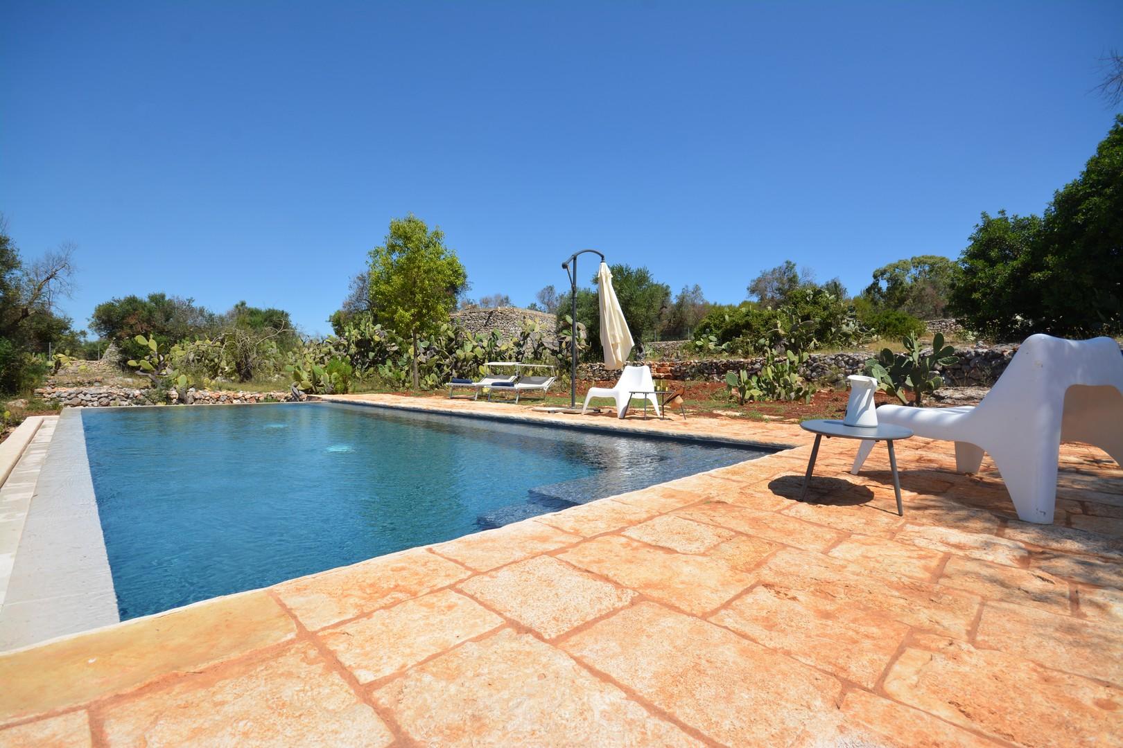 Swimming pool area with sea view