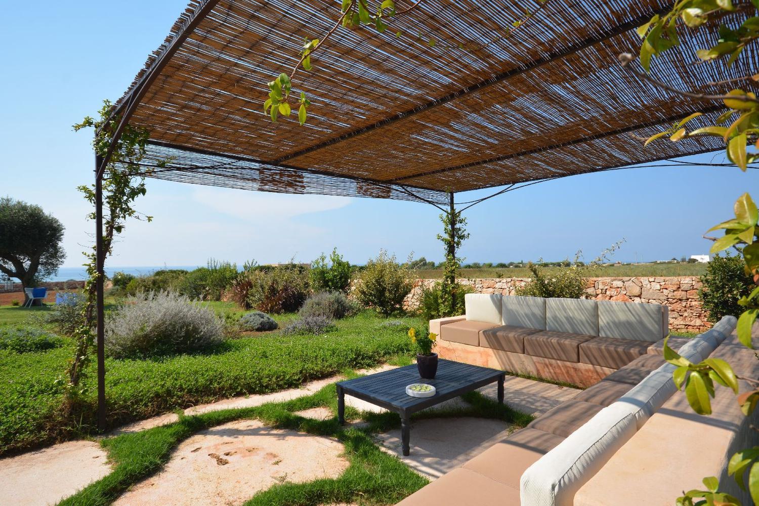 Pergola with sofas and sea view