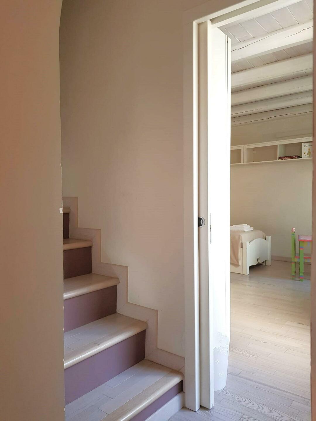 Staircase to double bedroom