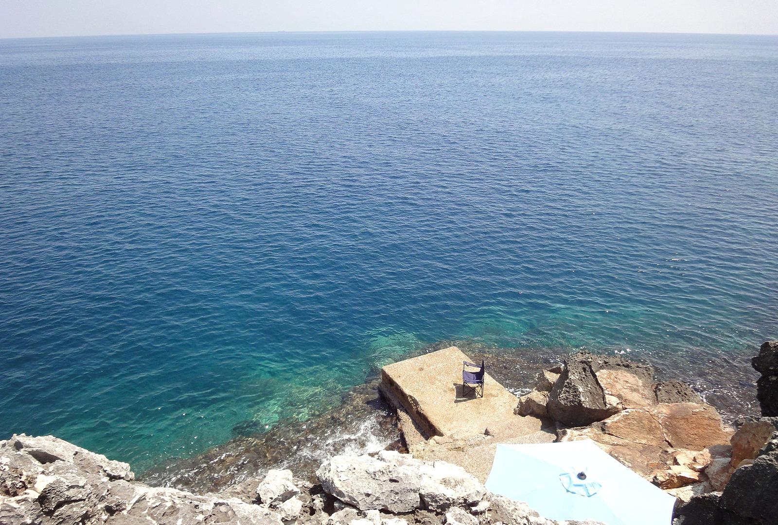 Private rocky cove sea access with platform