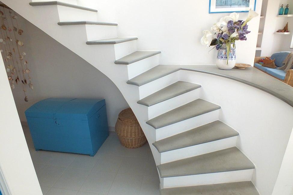 Living room stairs leading to the top floor solarium terrace