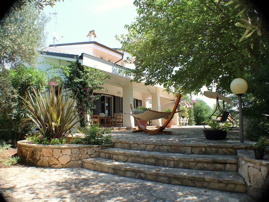 Backyard furnished pergola with relax corner