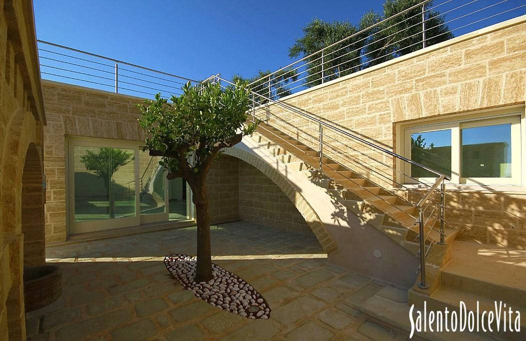 Small courtyard with stairs leading to roof top terrace