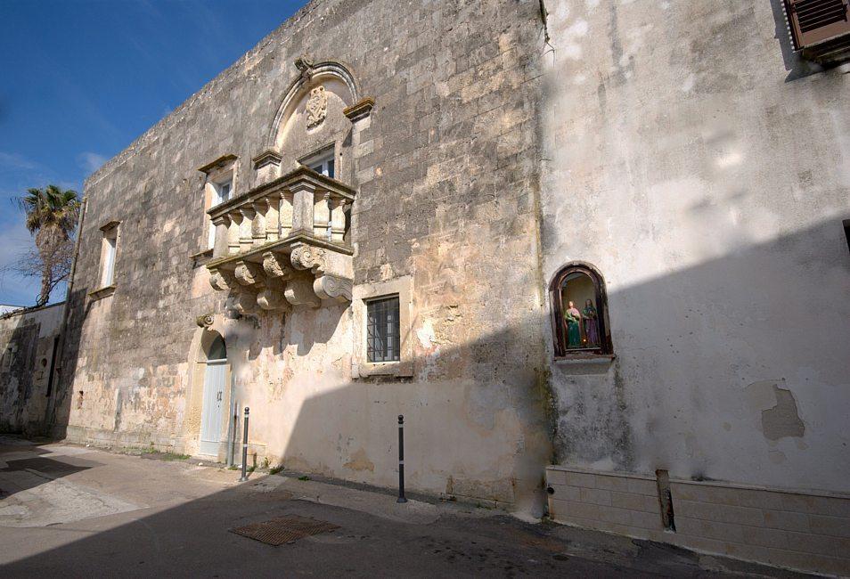 Faccade with ancient balcony