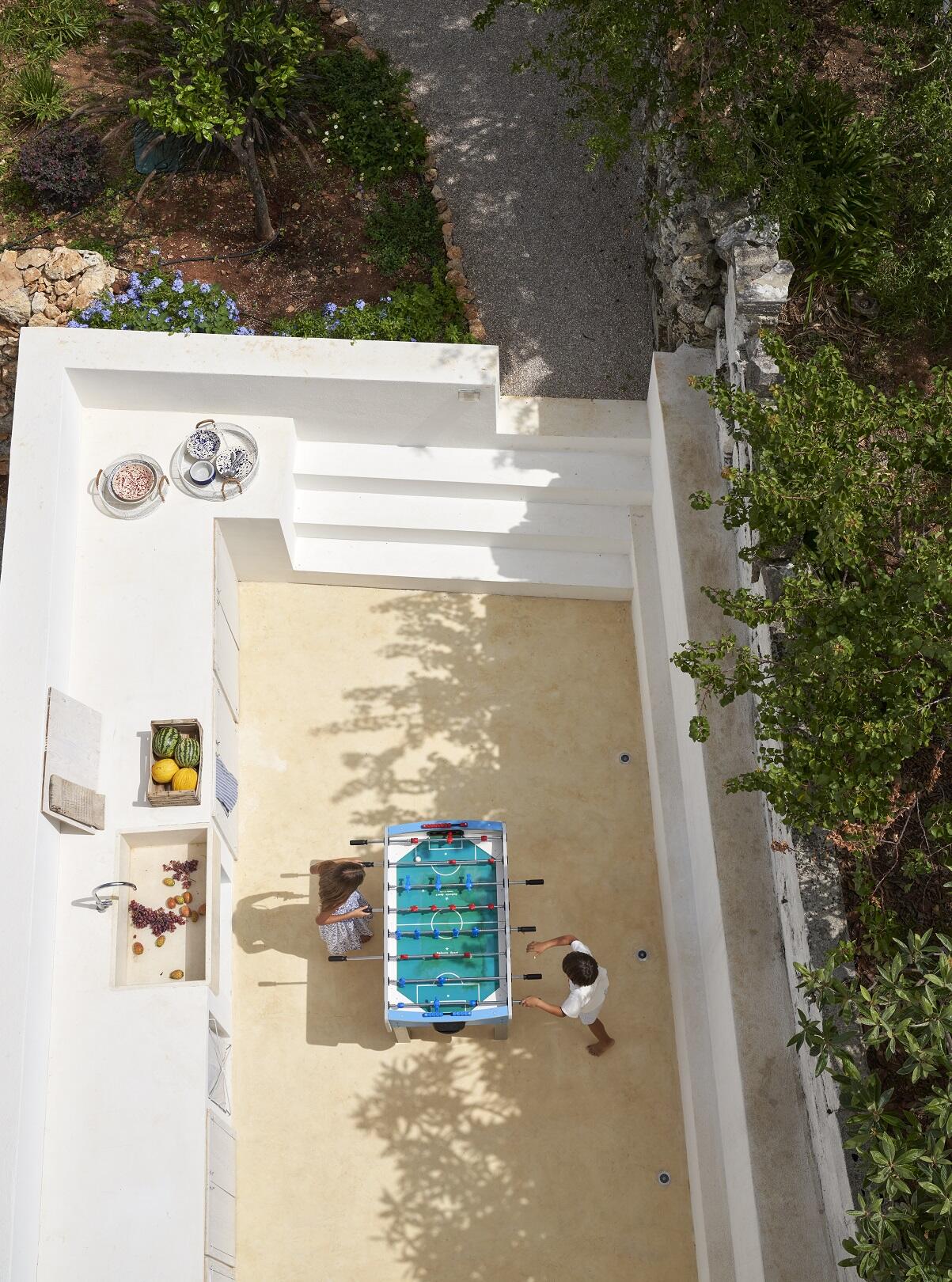 Laundry area with table football